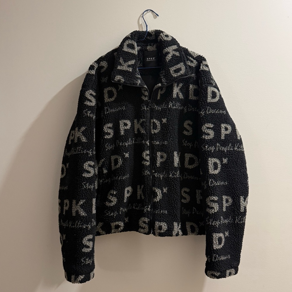 SPKD Logo Zip-Up Sherpa Jacket in Black and Cream